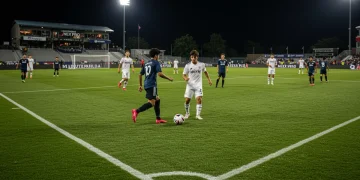 Young soccer players competing on a professional pitch under stadium lights, symbolizing the future of MLS.