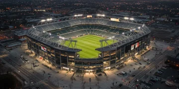 MLS Stadium Development: $500M Investment Drives 2025 Growth Modern MLS stadium illuminated at dusk, symbolizing growth and investment.