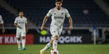 USL player dribbling ball, showcasing athleticism and skill on the field.